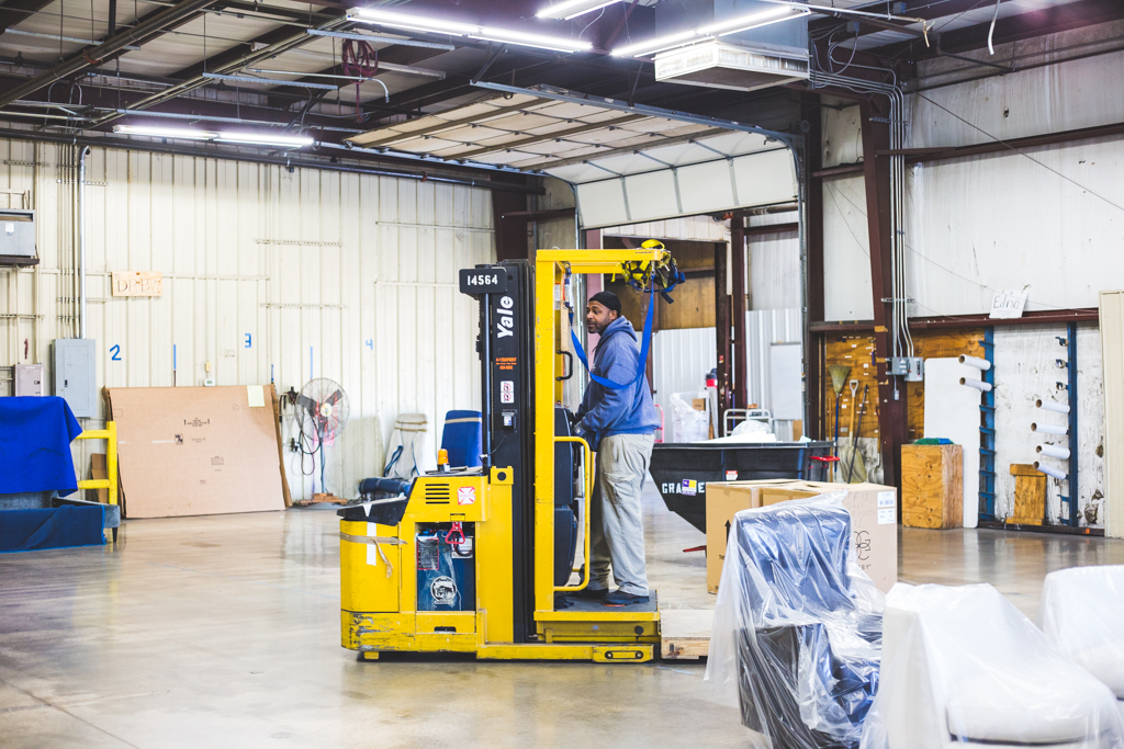 Arlan employee on forklift